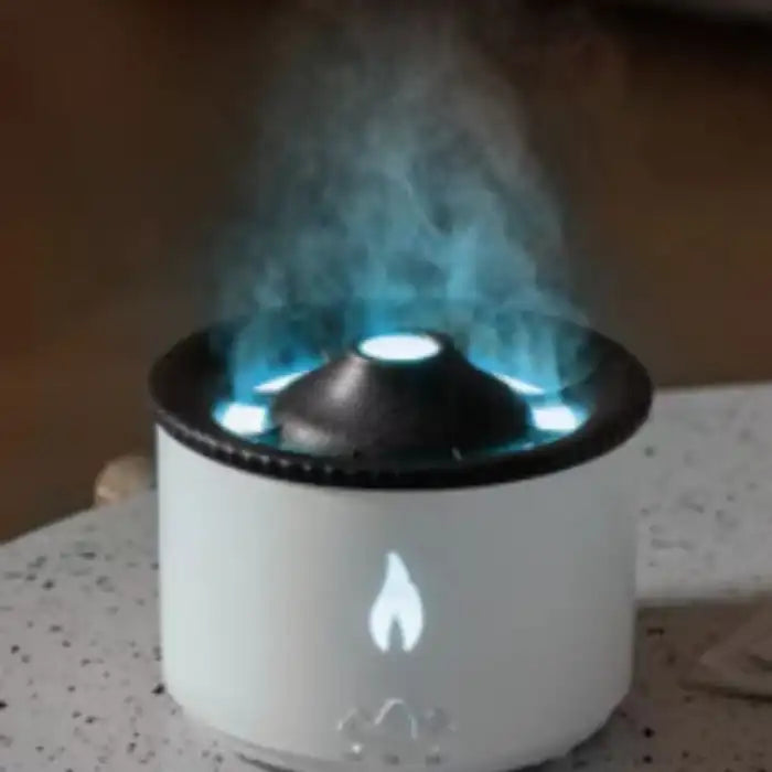 .Humidifier with cool blue LED light emitting vapor mist from black top design