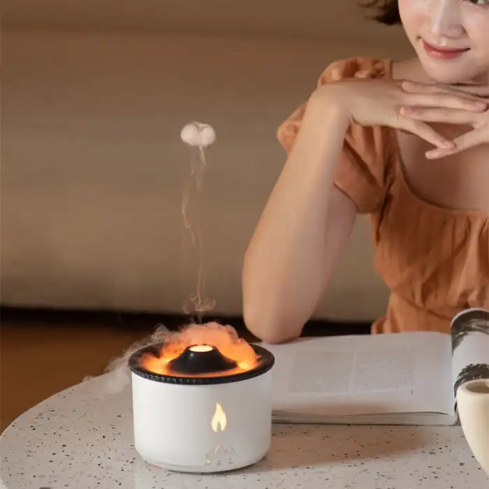 Humidifier with warm mist near woman reading, adding relaxation and aroma diffusion
