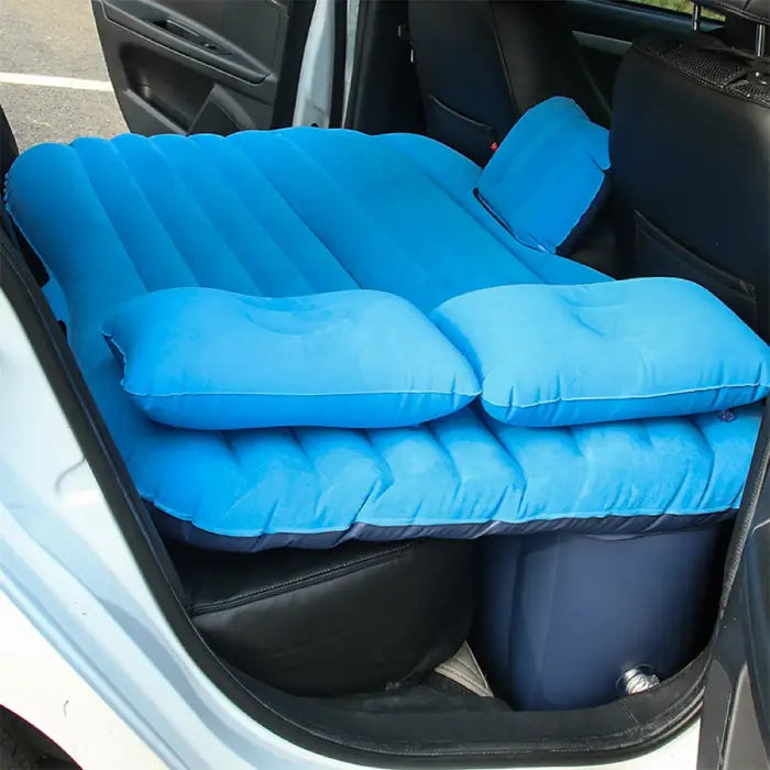car air mattress universal fit SUV backseat shown inflated with cozy blue pillows for naps