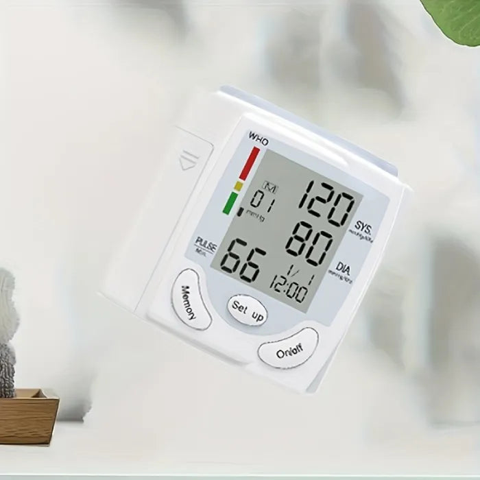 Angled view of wrist-mounted blood pressure tester showing systolic and diastolic readings.