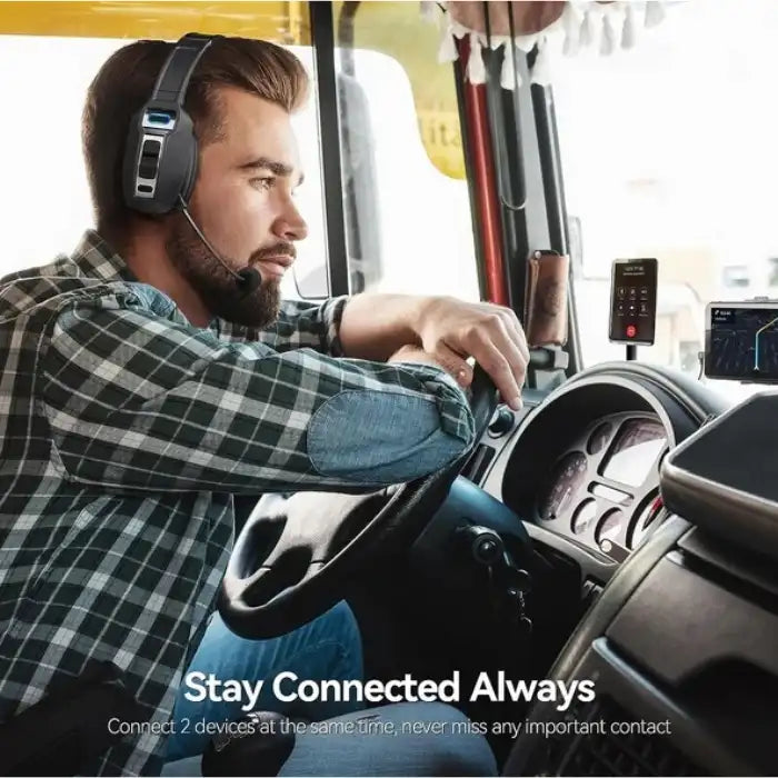 Bluetooth headset on male driver with two devices connected, highlighting always-on communication.