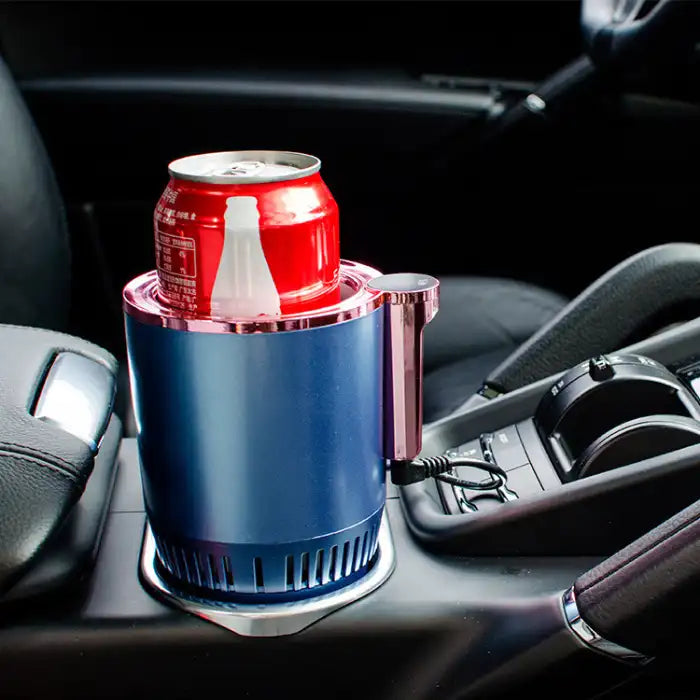 Car Heating Cooling Cup in metallic blue with a Coca-Cola can placed inside on a car console.
