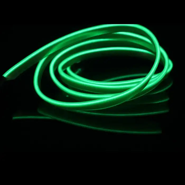 Green LED tube for car interiors coiled and glowing on black background