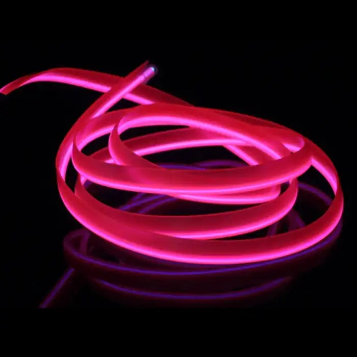 Bright pink LED strip glowing in coiled form for car dashboards and trims