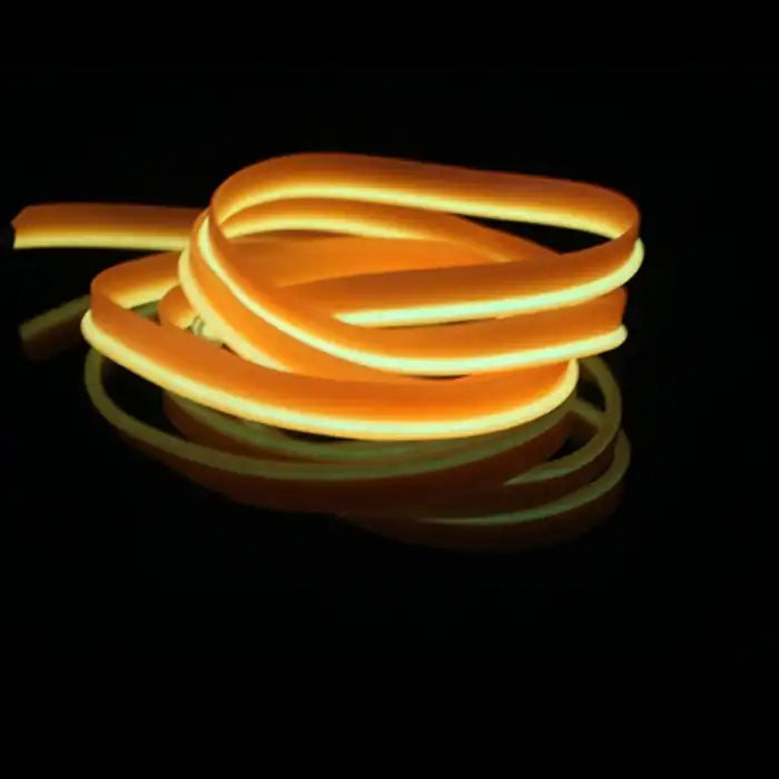 Orange LED strip with yellow glow effect coiled for dashboard and trim lighting