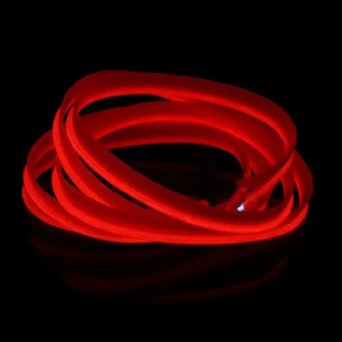 Coiled red LED strip glowing intensely for use in car interiors and dashboards
