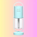 Aqua blue pastel humidifier with modern frame and clear tank on gradient background.