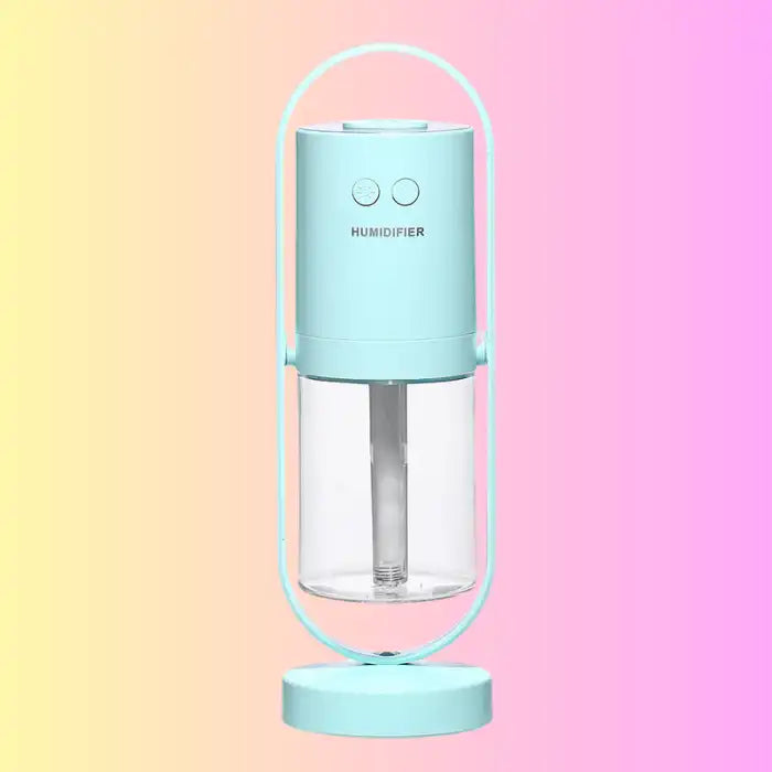 Aqua blue pastel humidifier with modern frame and clear tank on gradient background.