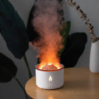 Humidifier with glowing fire effect and orange mist, creating a cozy atmosphere on wooden table
