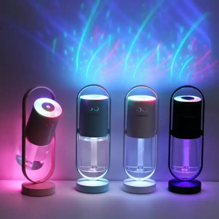 Four colorful humidifiers projecting mist with vivid LED light patterns.