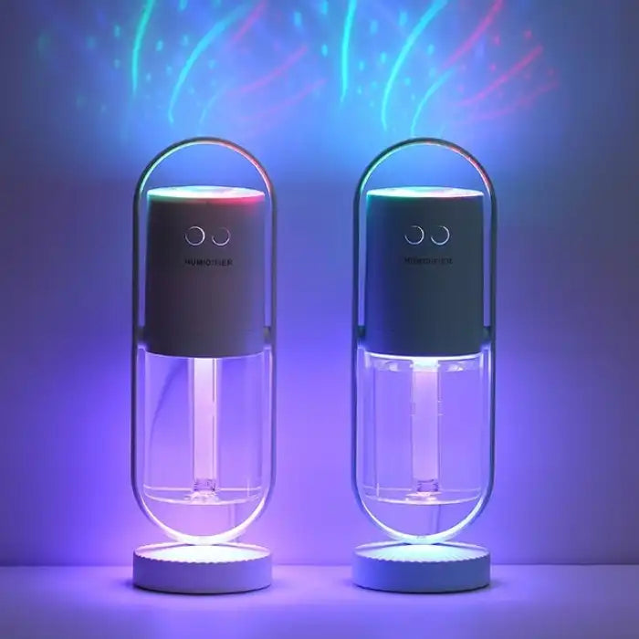Two humidifiers glowing in purple and blue LED light for ambient night lighting.