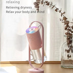 Pink humidifier misting by the window with calming light for dryness relief.