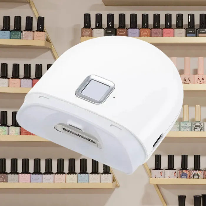 Infant nail clipper placed in salon environment with shelves of colorful nail polish behind.