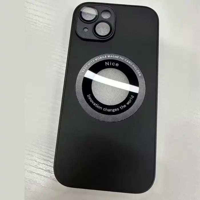 Smooth black iPhone protective case with circular magnetic ring on white surface