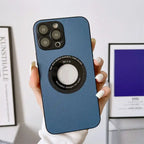 Blue leather iPhone protective case held by hand with modern interior in background