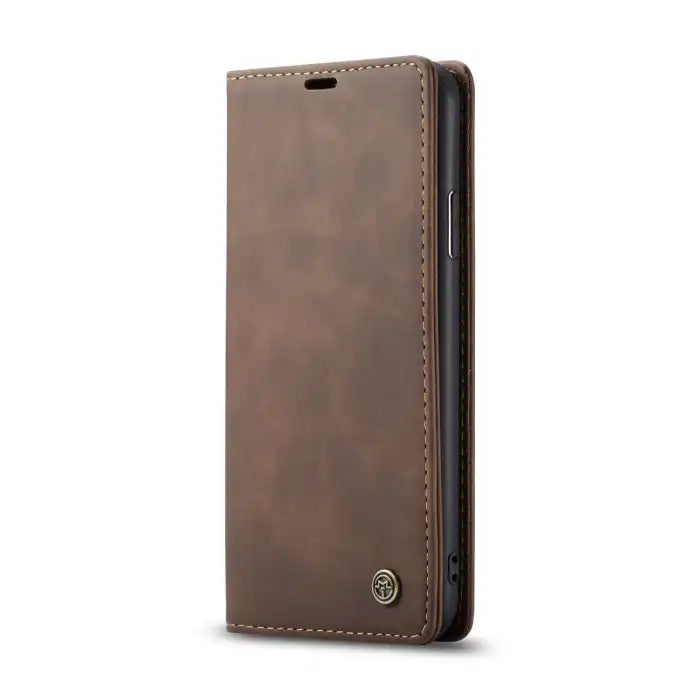 Leather phone case in brown with vintage finish, stitched edges, and flip front cover.