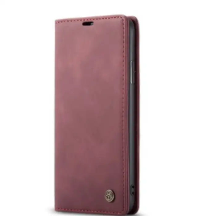 Leather phone case in rose pink with flip cover design and stitched edges for stylish protection.