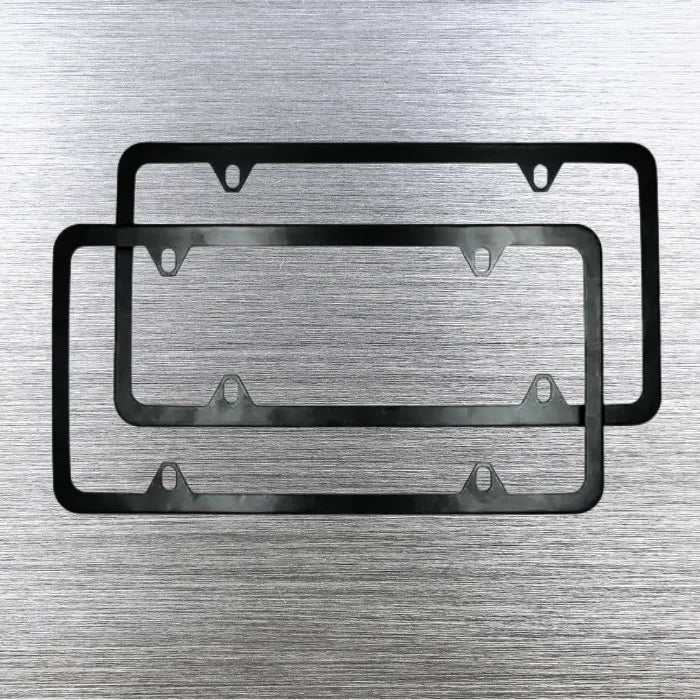 Two black license plate holder frames displayed on brushed metal background.