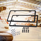 License plate holder kit with screws, caps, and gaskets shown in an automotive garage setup.