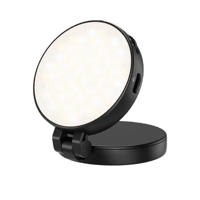 : Magnetic Selfie Light close-up view showing LED layout and USB charging port on round black base.