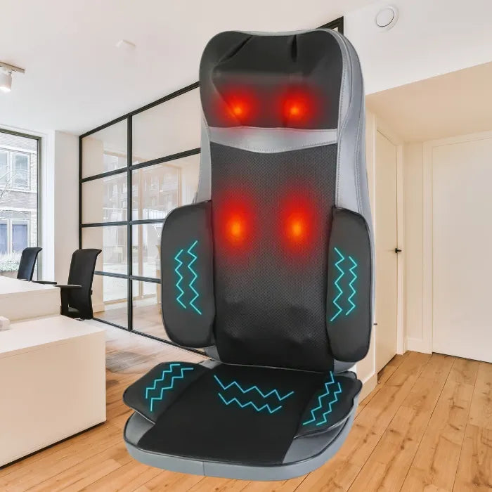 Massager for chair displayed in modern office, red heating lights activated on back and neck.