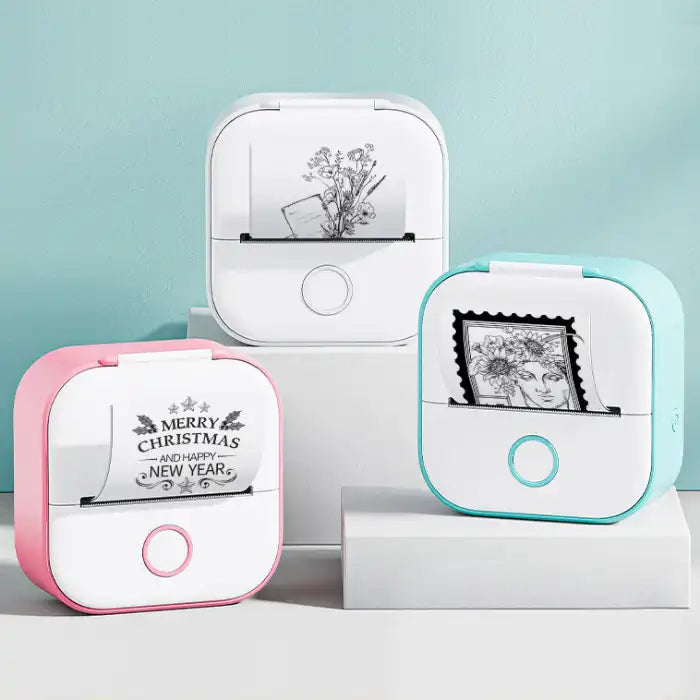 Mini Thermal Printer in pink, white, and mint colors printing holiday and floral artwork