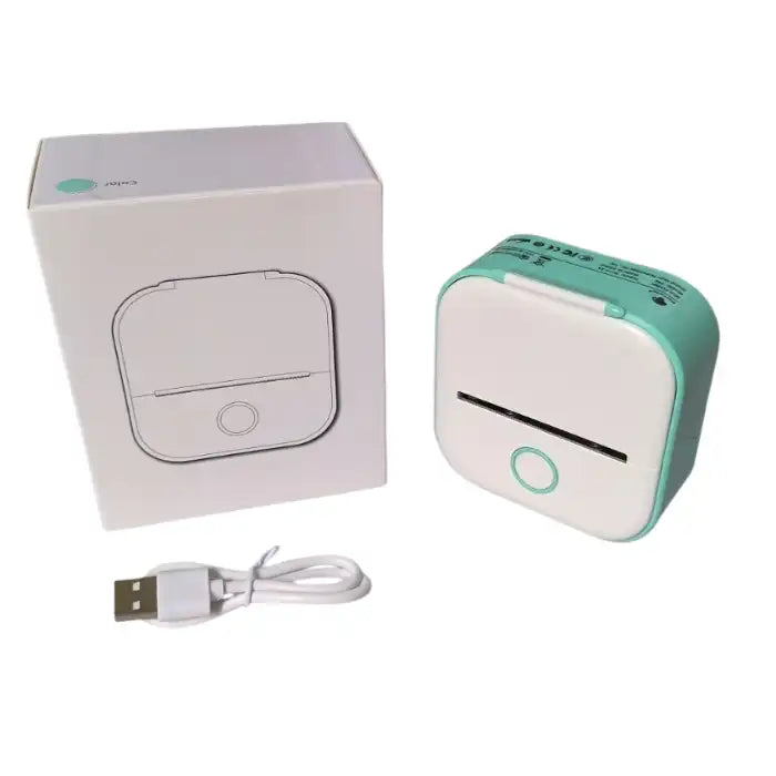 Mini Thermal Printer shown with packaging box and USB charging cable on white desk