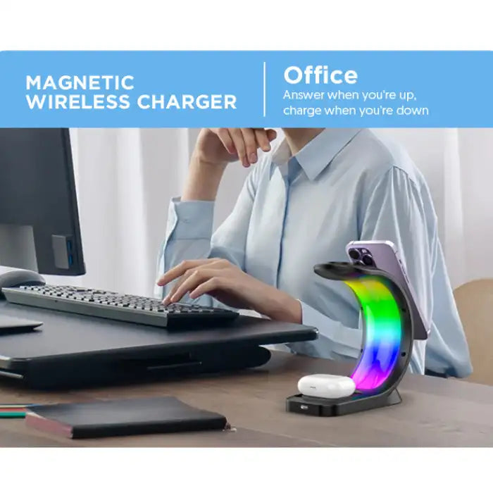 Wireless charging station placed on office desk charging phone and AirPods with ambient RGB light.
