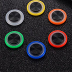 Assorted Phone Joystick colors placed on a black table surface for display