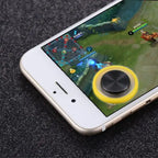Yellow Phone Joystick attached to smartphone screen during active mobile gameplay