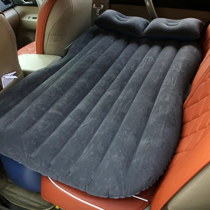 Portable car air mattress with built-in pillows designed for vehicle backseat comfort, featuring dark gray inflatable design for travel