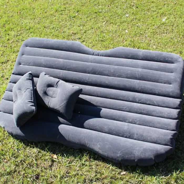 Portable black car air mattress with two pillows perfect for camping and outdoor travel adventures