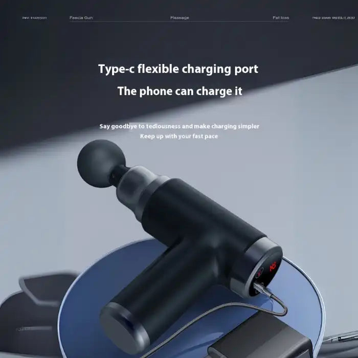Portable massage gun with USB type-C charging port connected for fast and easy charging