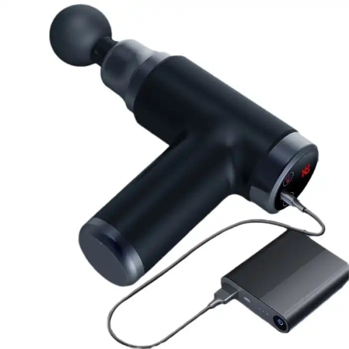 Portable massage gun connected to USB power bank, showcasing convenient travel charging option.