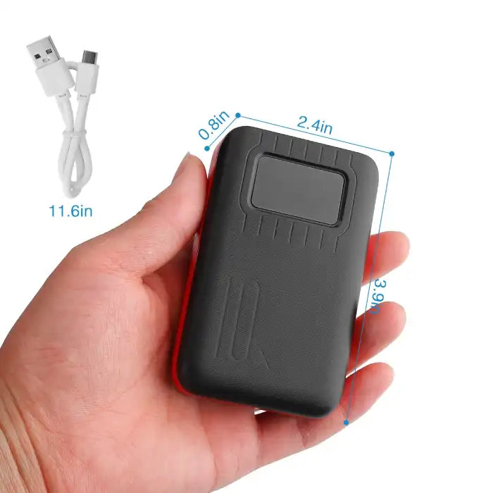 Power Bank held in hand with cable and clear size dimensions, ideal for on-the-go use and travel.