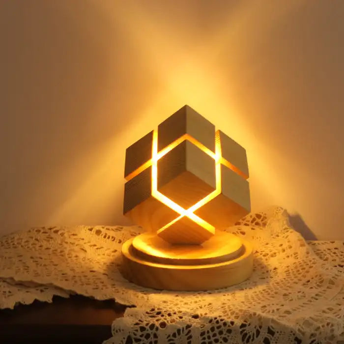 Rubix cube night light battery powered casting warm light in corner of lace-covered table