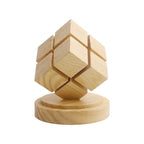 Rubix cube night light with battery power off, showing natural wood base and cube design