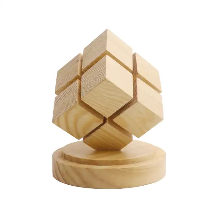 Rubix cube night light with battery power off, showing natural wood base and cube design