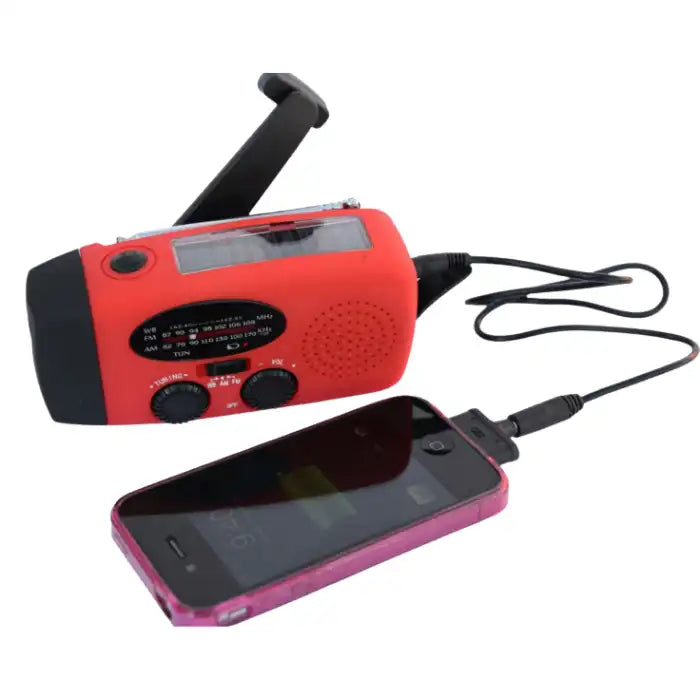 Survival Radio charging a smartphone via cable, showing emergency power supply functionality.