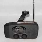 Survival Radio with hand crank, AM/FM tuner, and telescopic antenna in black emergency-ready design.