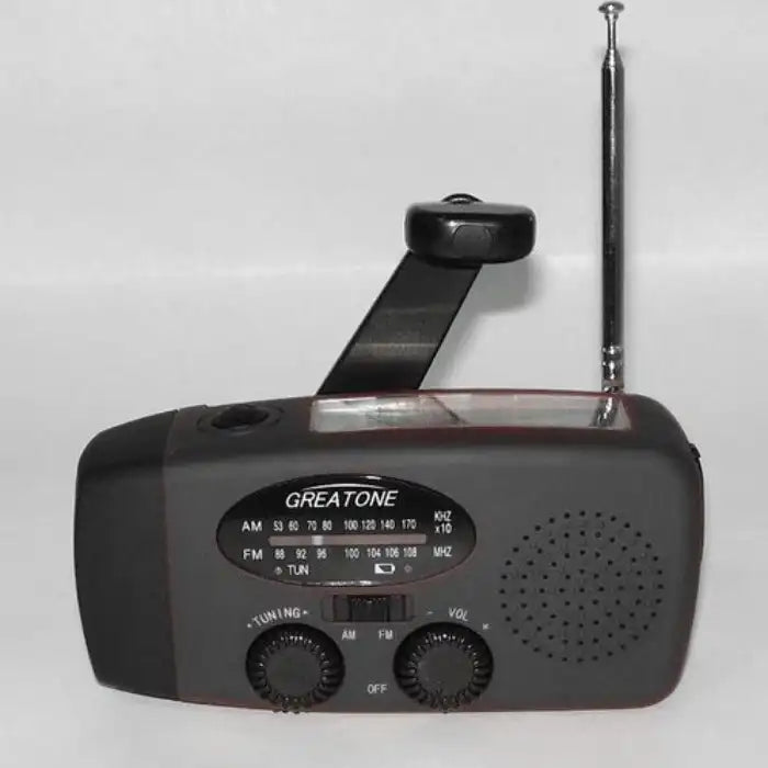 Survival Radio with hand crank, AM/FM tuner, and telescopic antenna in black emergency-ready design.