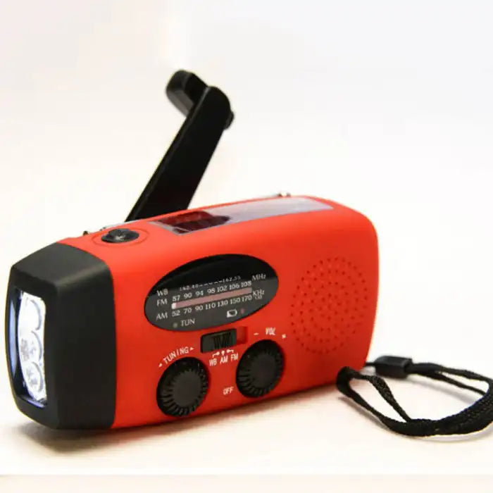 Survival Radio in red with hand crank, AM/FM/WB tuner, and flashlight feature for emergency use.