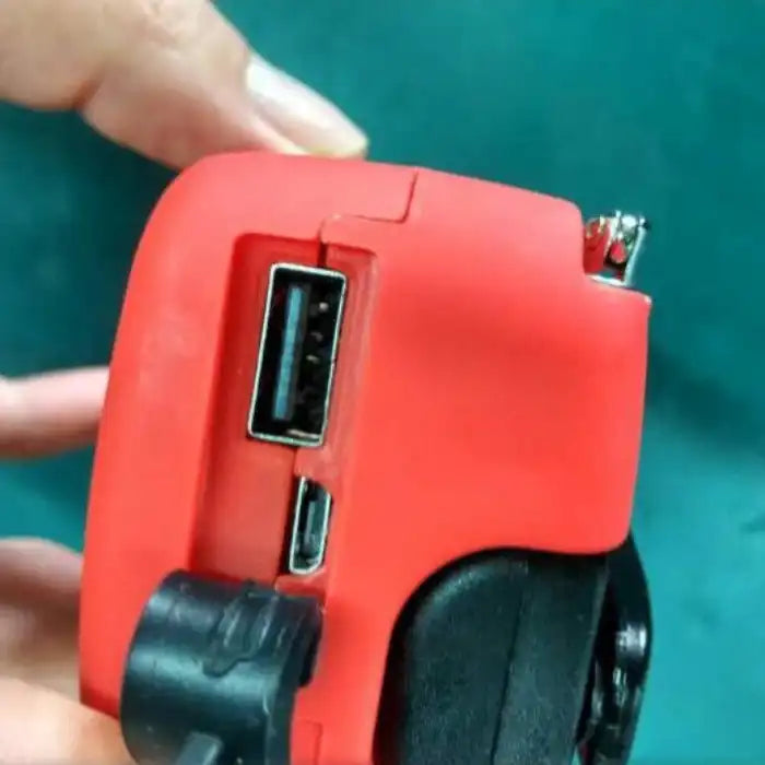 Survival Radio close-up view of USB and micro USB charging ports for powering mobile devices.