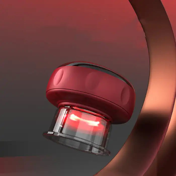 Close-up of vacuum massager emitting red LED heating light with modern background