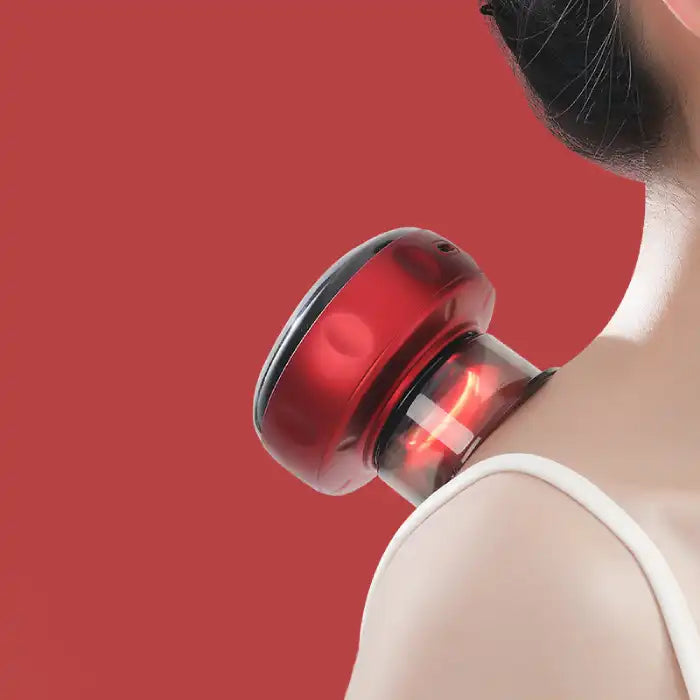 Red vacuum massager placed on neck for cupping therapy on red background