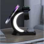 Wireless charging station in dark setting with white arc light charging phone, watch, and earbuds.