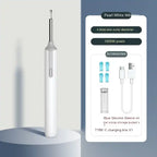 White wireless ear cleaner with blue silicone tips, USB-C cable, and storage case